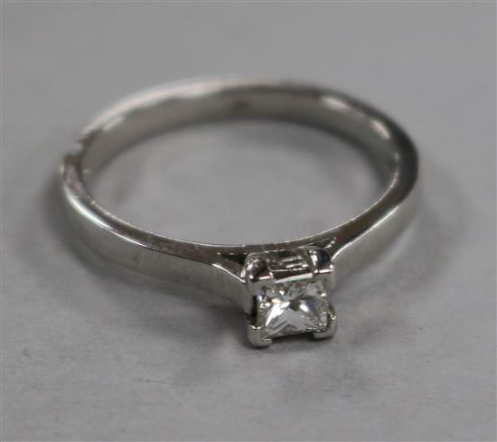A modern platinum and solitaire princess cut diamond ring, size N.